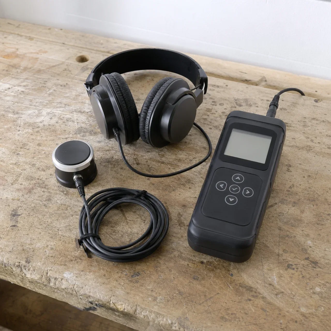 Acoustic water-leak detector, headphones and contact sensor