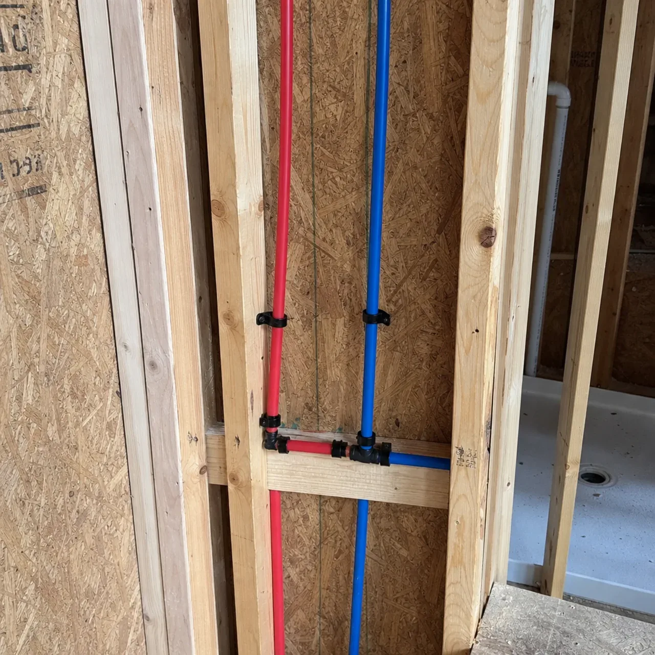 Water supply lines in unfinished wall framing